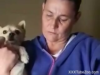 Aroused mature woman craves her dog's dick for oral fun